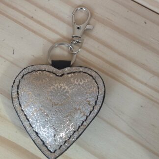 Porte clef/bijoux de sac coeur  doré fleuri et noir